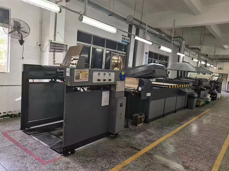 Automatic screen printing machine for Spot UV coating at Color Creative Packaging, flatbed silk screen press for high-gloss spot varnish on packaging